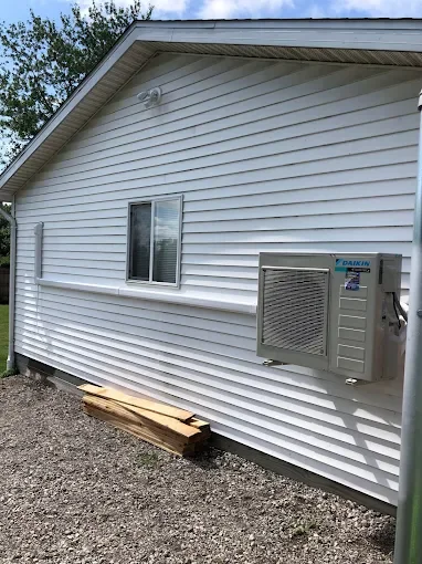 Daikin ductless mini-split outdoor unit installed on a home